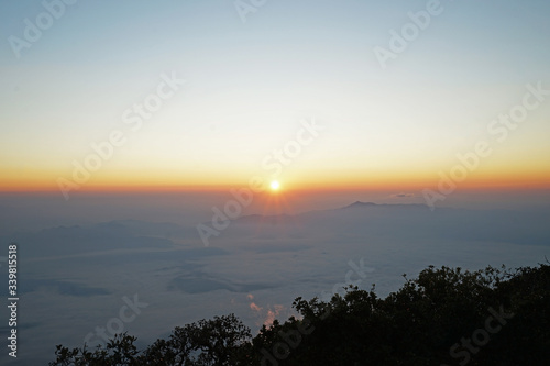 Sunrising view on top of the mountain peak