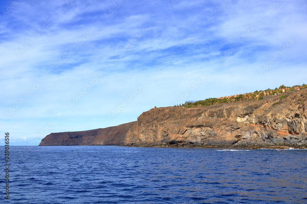 Rocky cliffs on the shore on the coast of La Gomera Island, Canary Islands in Spain Rocky cliffs on the shore on the coast of La Gomera Island, Canary Islands in Spain