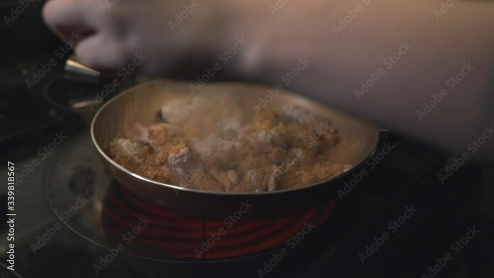 A Person Cooking Meat and Putting The Ingredients On A Frying Pan - Closeup Shot
A Person Cooking Meat and Putting The Ingredients On A Frying Pan - Closeup Shot