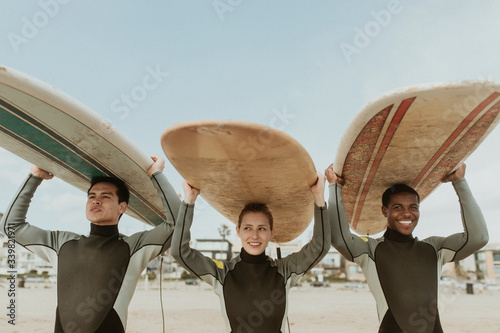 Photography Surfer team holding surfboards
