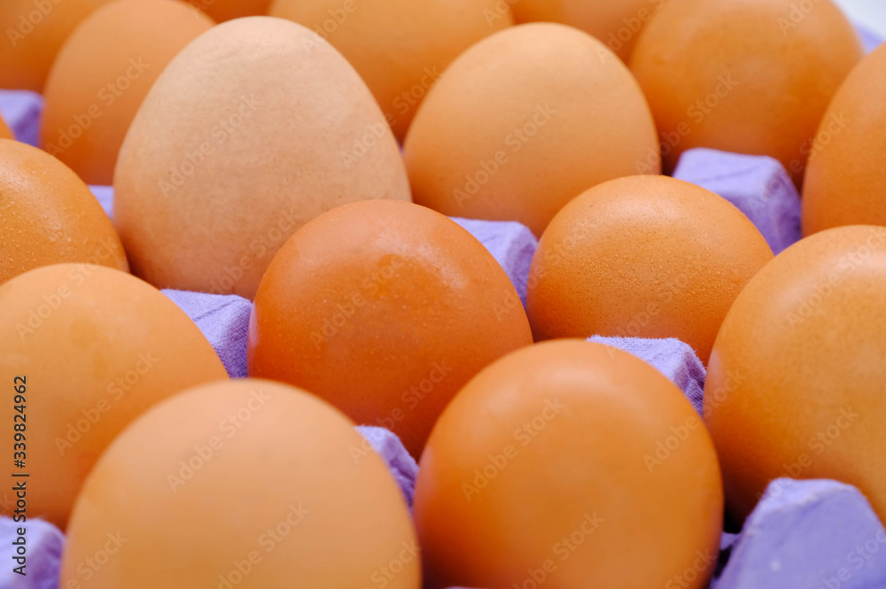 Close-up view of raw chicken eggs on background Close-up view of raw chicken eggs on background