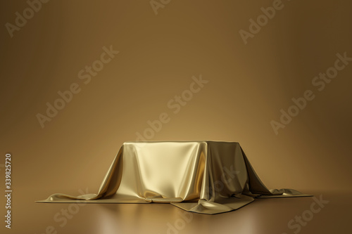 Golden luxurious fabric placed on top pedestal or blank podium shelf on gold background with luxury concept. 3D rendering. photo