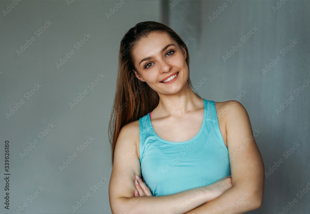 Attractive fit smiling young woman sport wear fitness girl model portrait at home loft studio workout class Attractive fit smiling young woman sport wear fitness girl model portrait at home loft studio workout class