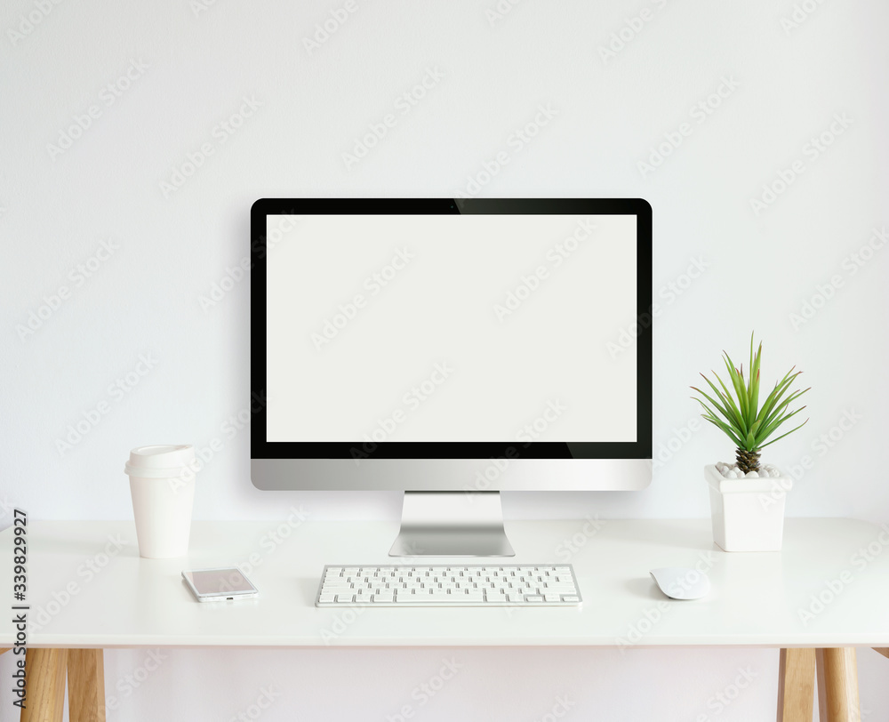 modern computer monitor template mock up on white work desk with blank screen modern computer monitor template mock up on white work desk with blank screen