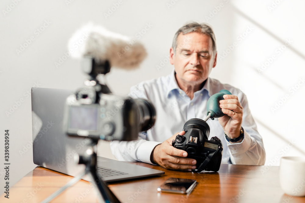 Photographer vlogging about cameras