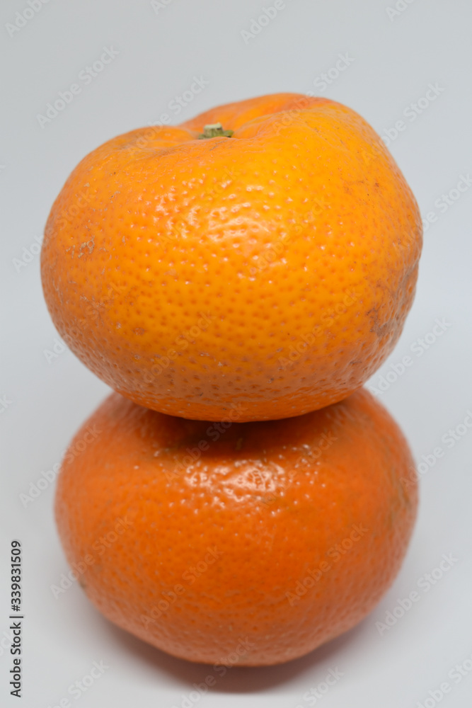 Orange tangerine with peel photographed on a white background,fruits and vitamin c Orange tangerine with peel photographed on a white background,fruits and vitamin c