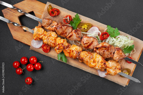 Hot grilled chicken shish kebab, with cherry tomatoes,