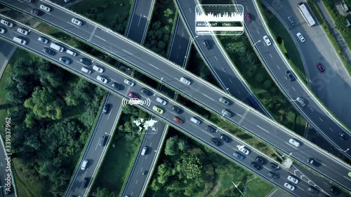 Aerial view of self driving autopilot cars driving on a highway