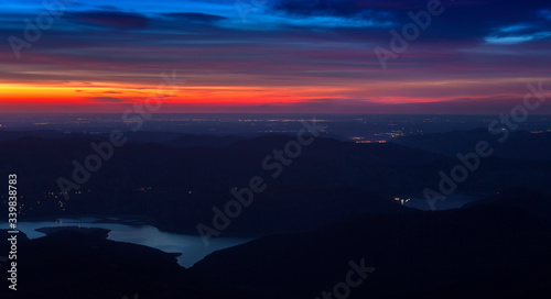 sunset and lake, landscape view from Ceahlau mountain. Romania
