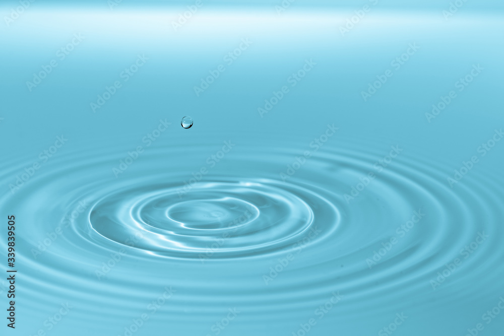 Waves on the surface of the water from a collision. Drop of water drop to the surface.