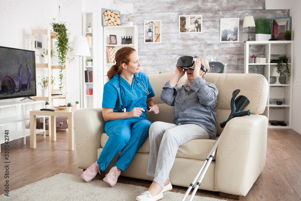 Amased elderly age woman while using virtual reality glasses Amased elderly age woman while using virtual reality glasses