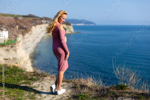 blonde model by the sea at the summer 
