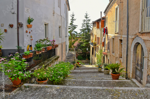 Fototapeta Naklejka Na Ścianę i Meble -  A narrow street between the old houses of a medieval village