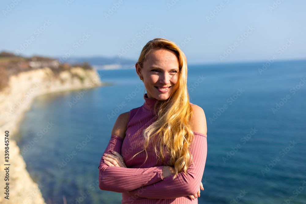 blonde model on the beach at the summer 