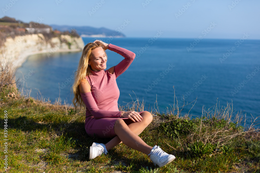 blonde model on the beach at the summer blonde model on the beach at the summer