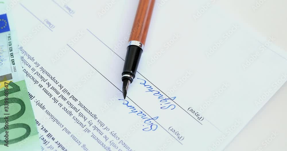 Close up of hand signing document. Signing the contract using a wooden fountain pen. Beautiful handwriting. Stabilized footage. Close up of hand signing document. Signing the contract using a wooden fountain pen. Beautiful handwriting. Stabilized footage.