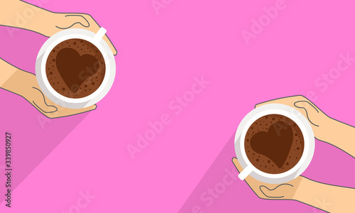 Hands holding a cup of coffee on pink background.
