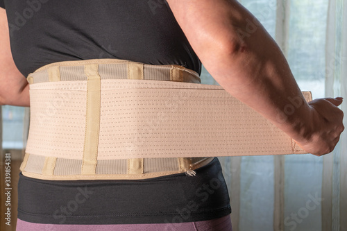 Lumbar corsets, posture corrector for women. A wide belt to support the back muscles.