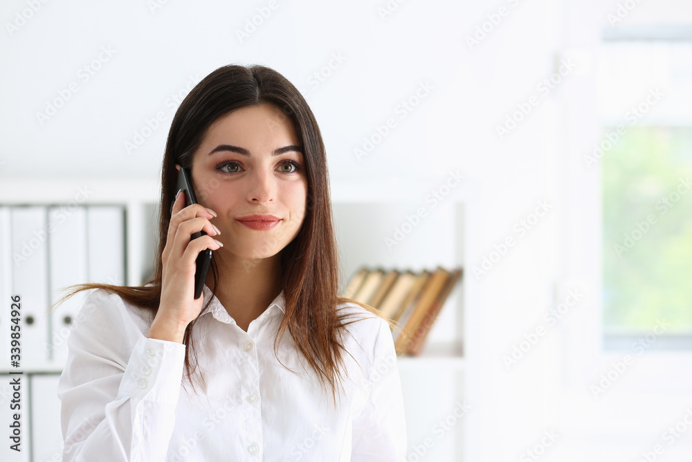 Beautiful brunette smiling businesswoman talk cellphone in office portrait. Stay in touch negotiate meeting job white collar busy life style electronic device store professional training concept Beautiful brunette smiling businesswoman talk cellphone in office portrait. Stay in touch negotiate meeting job white collar busy life style electronic device store professional training concept