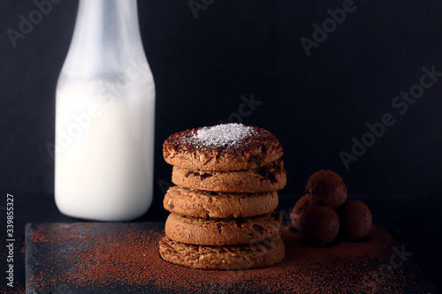 Chocolate cookies on wooden table. Chocolate chip cookies shot.. cookies look like very delicious with milk and chocolate balls (ID: 339855327)