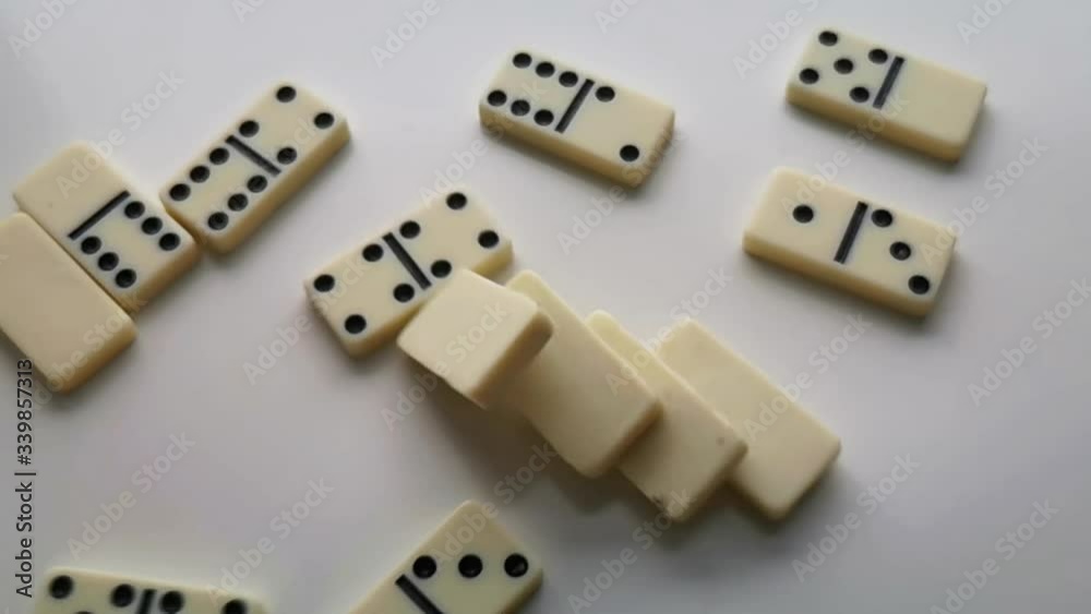 dominoes white with black dots fall and bounce dominoes white with black dots fall and bounce