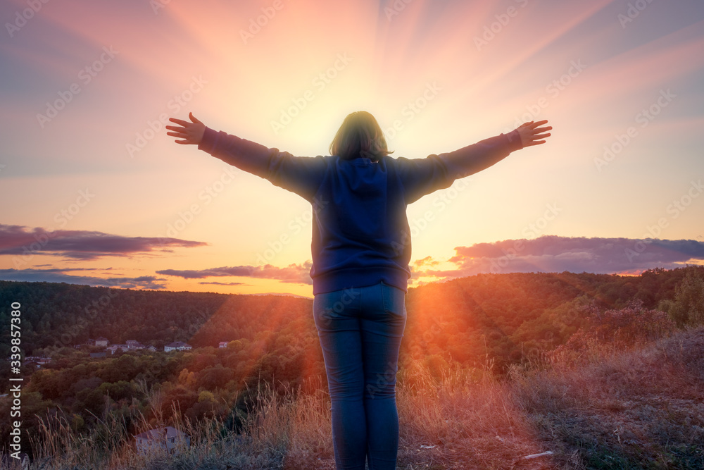 silhouette of woman on top of mountain at sunset - god loves you silhouette of woman on top of mountain at sunset - god loves you