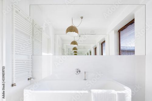 White bathroom with big washbasin
