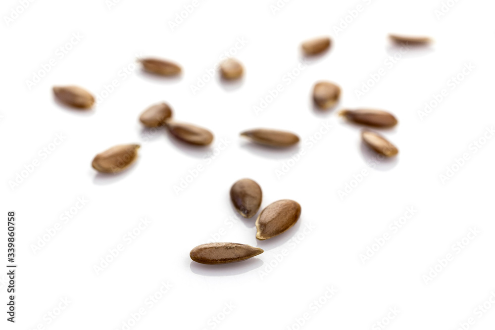 Obraz premium Seeds Linum isolated on white. Pile healthy Linseed food on organic background. Superfood high vitamin e, antioxidant, omega-3, protein and dietary fiber for healthy food.