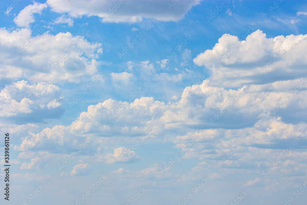 Cloudy weather, blue sky with cumulus clouds, cloudscape background wallpaper backdrop. Natural sky for design