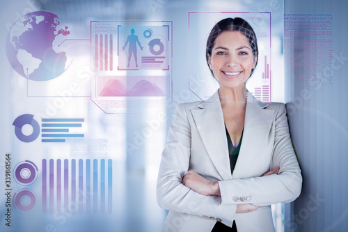 Closeup portrait of smiling beautiful middle-aged business woman wearing jacket, looking at camera through face scan infographics with her arms crossed. Front view.