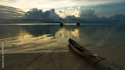 Timelapse of Sunrise view of sea gypsy water village of Bajau Laut in Maiga Island, Borneo. Semporna, Sabah. photo