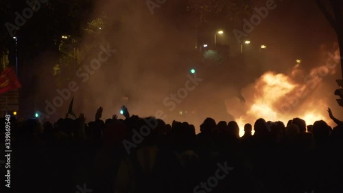 Fire, Chaos and Riots in the streets. People protesting and challenging the police photo
