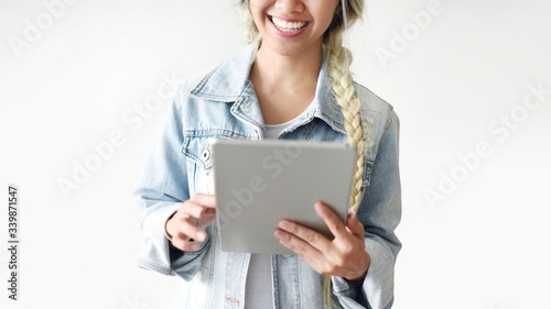 Blonde Asian woman with a tablet
