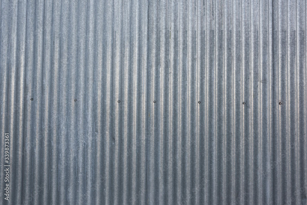 An old grey metal fence An old grey metal fence