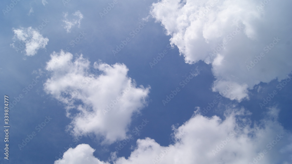 Obraz premium fluffy white clouds in the blue sky