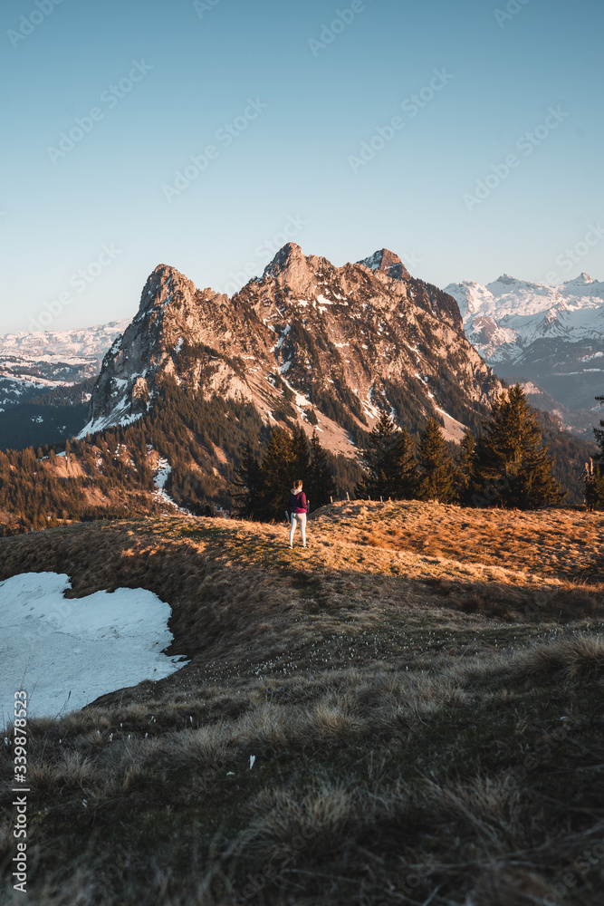 Girl on a walk on mountain peaks