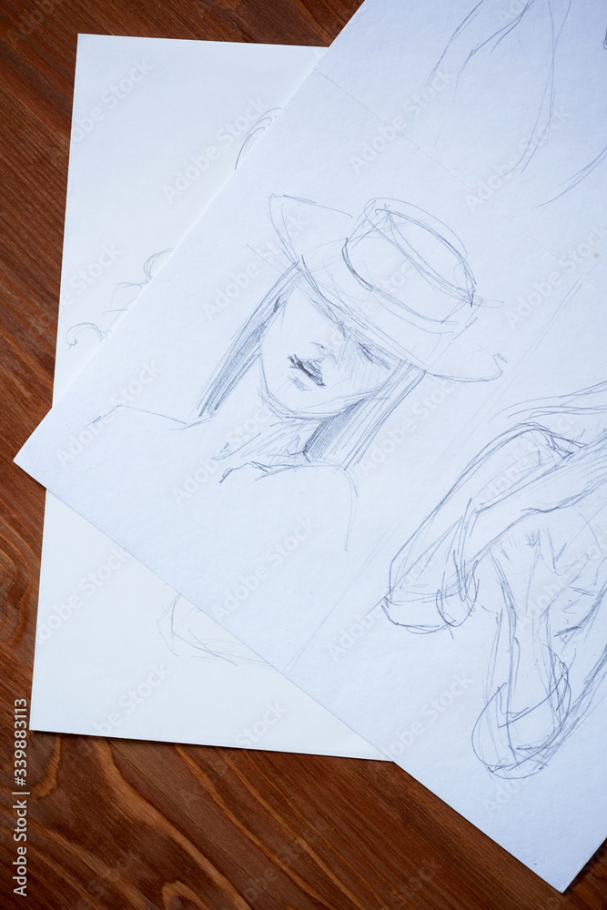 Sketches, sketching on white paper with a simple pencil. Colour pencils Sketches, sketching on white paper with a simple pencil. Colour pencils