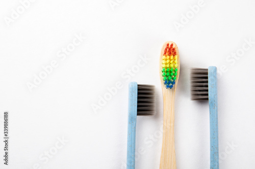 Three toothbrushes on a white background