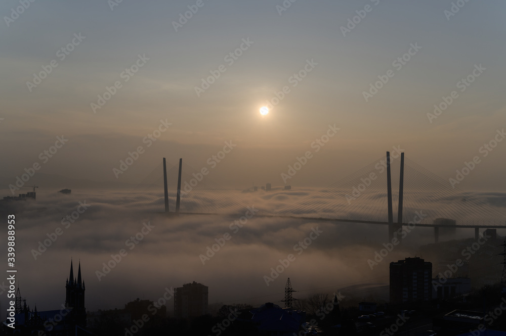 Fototapeta premium Vladivostok cityscape daylight view. Fog over the city.