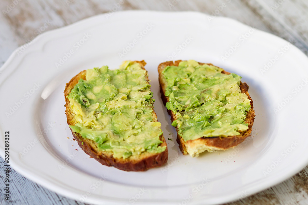 Mashed avocada and whole grain bread healthy toastes Mashed avocada and whole grain bread healthy toastes