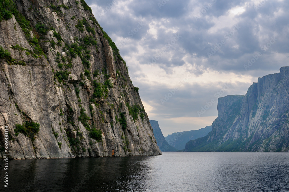 Steep Igneous rock wall at Western Brook Pond inland fjord at Gros Morne National Park Newfoundland