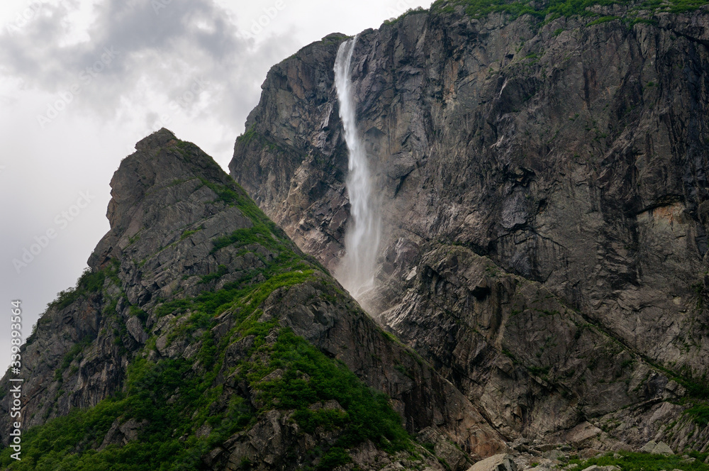 Detail of Pissing Mare Falls at east end of Western Brook Pond with steep cliff fjords at Gros Morne National Park Newfoundland