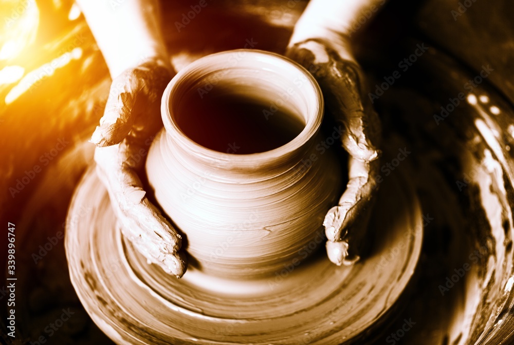 Hand of potter doing clay pot Hand of potter doing clay pot