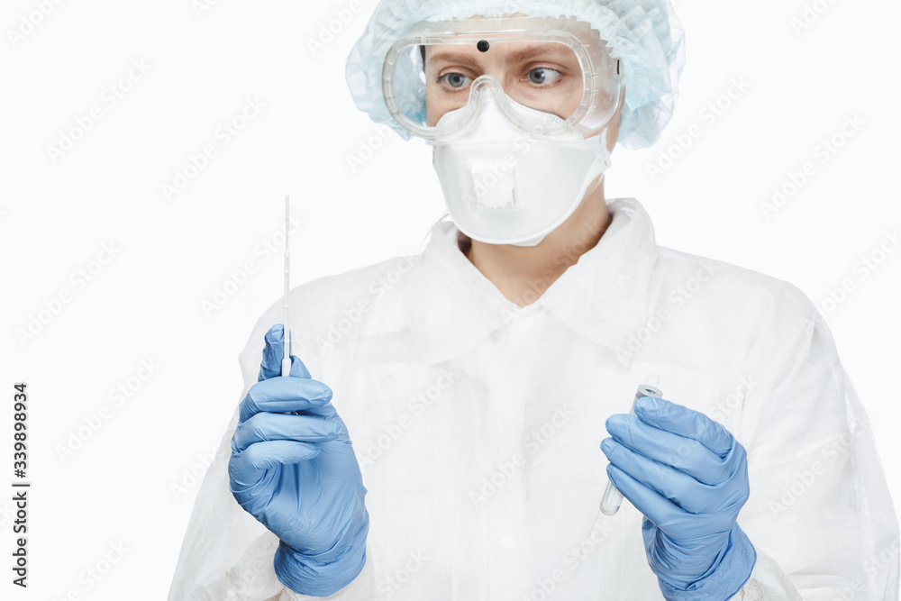 Doctor in protective suit ready to perform saliva testing diagnostic procedure Doctor in protective suit ready to perform saliva testing diagnostic procedure