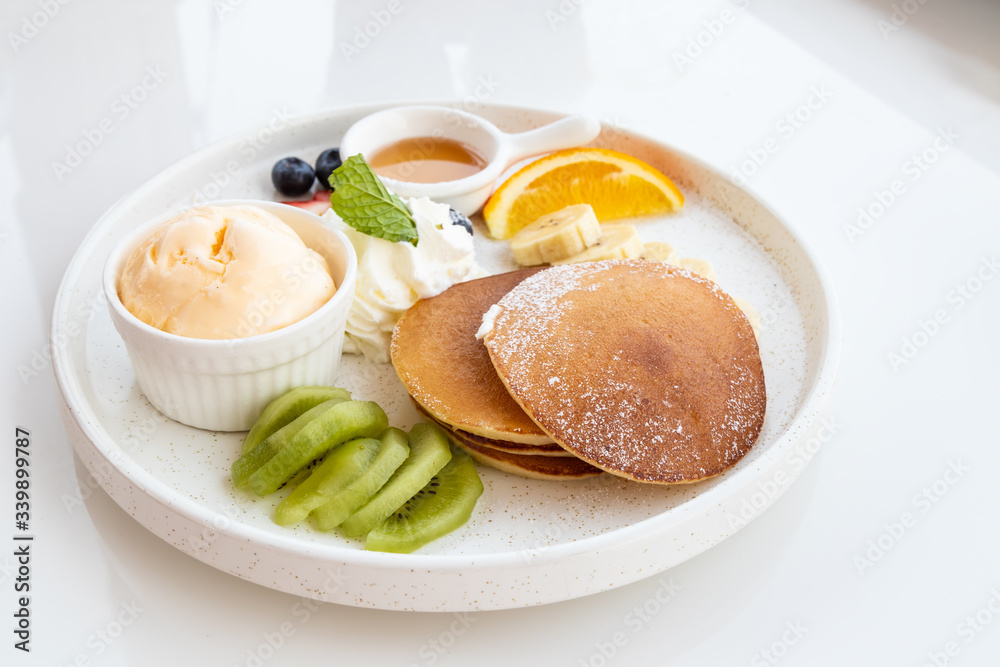 Pancake with fruits, vanilla ice cream and whipped cream Pancake with fruits, vanilla ice cream and whipped cream