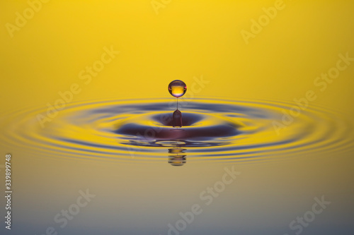 water drop on yellow background