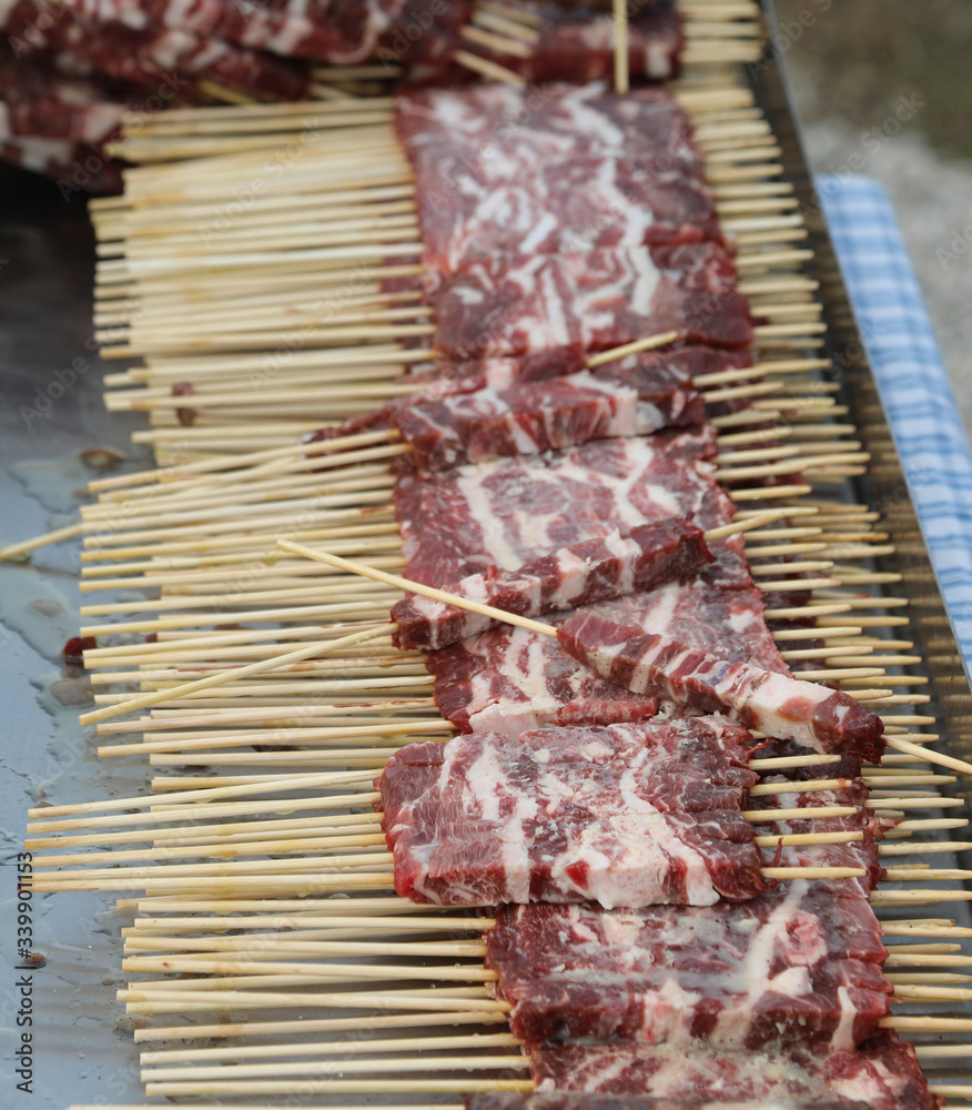 skewers of raw lamb and mutton called ARROSTICINI in Italian lan
