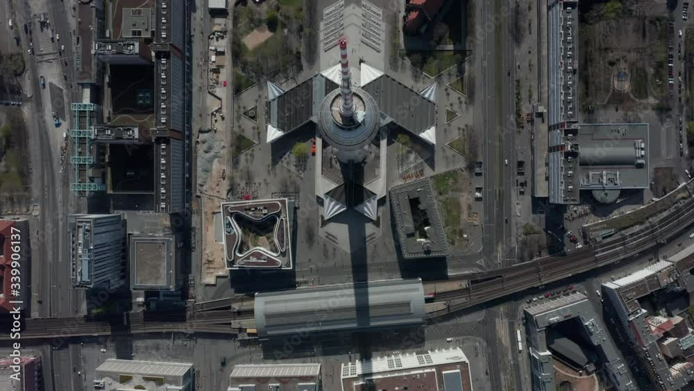 AERIAL: Breathtaking Overhead Aerial Fly Over Alexander Platz TV Tower in Empty Berlin, Germany with almost People or Cars on Beautiful Sunny Day AERIAL: Breathtaking Overhead Aerial Fly Over Alexander Platz TV Tower in Empty Berlin, Germany with almost People or Cars on Beautiful Sunny Day