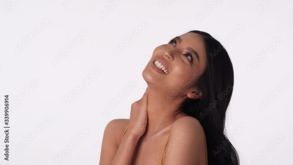 Portrait of beautiful asian woman smile and laugh joyfully on isolated white background. Concept of beauty, cosmetic, healthcare, fashion and skincare. 4K UHD. Portrait of beautiful asian woman smile and laugh joyfully on isolated white background. Concept of beauty, cosmetic, healthcare, fashion and skincare. 4K UHD.