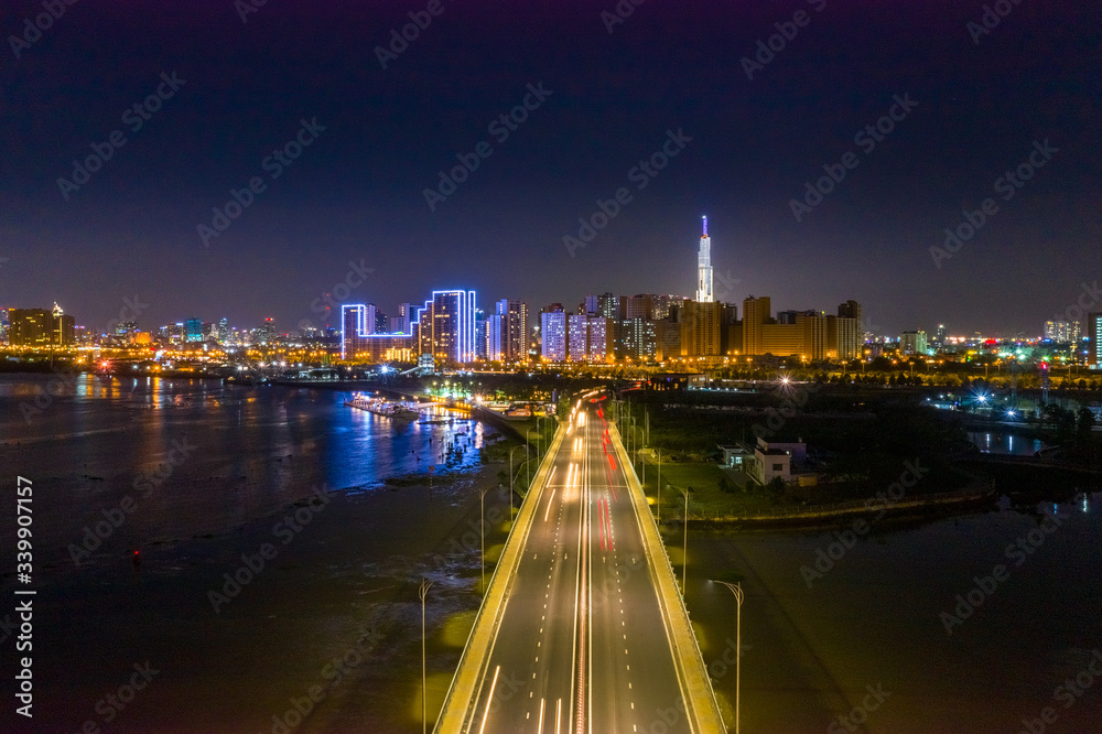 Fototapeta premium Top view aerial of a Ho Chi Minh City with development buildings, transportation, energy power infrastructure. View from Diamond island, District 2. Sai Gon, Vietnam